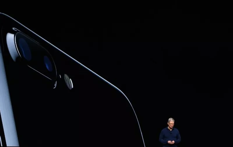 Apple CEO Tim Cook introduces the new iPhone 7 during an event inside Bill Graham Civic Auditorium in San Francisco, California on September 07, 2016.   / AFP PHOTO / Josh Edelson