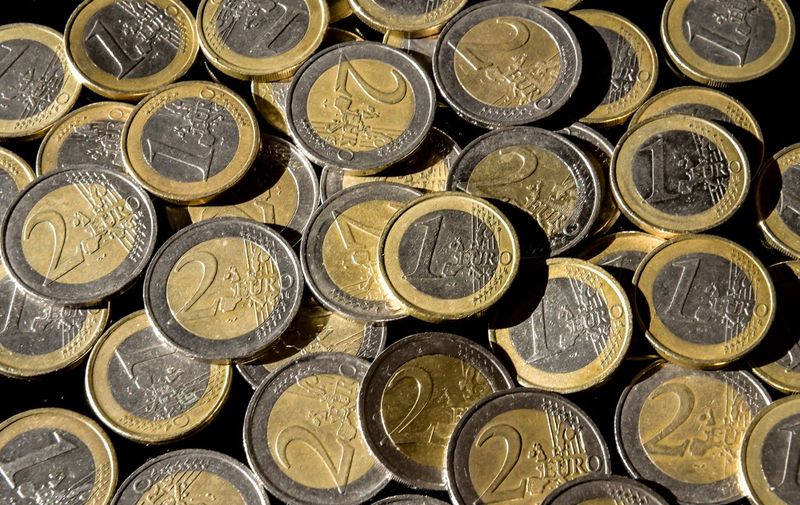 This illustration picture taken on March 8, 2019 in Lille shows one and two Euro coins. (Photo by PHILIPPE HUGUEN / AFP)
