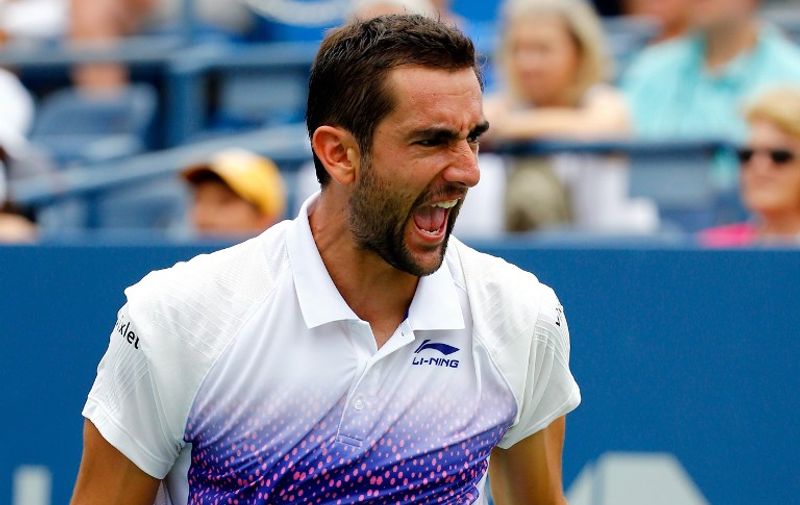 NEW YORK, NY - SEPTEMBER 04: Marin Cilic of Croatia celebrates a point against Mikhail Kukushkin of Kazakhstan during their Men's Singles Third Round match on Day Five of the 2015 US Open at the USTA Billie Jean King National Tennis Center on September 4, 2015 in the Flushing neighborhood of the Queens borough of New York City.   Al Bello/Getty Images/AFP