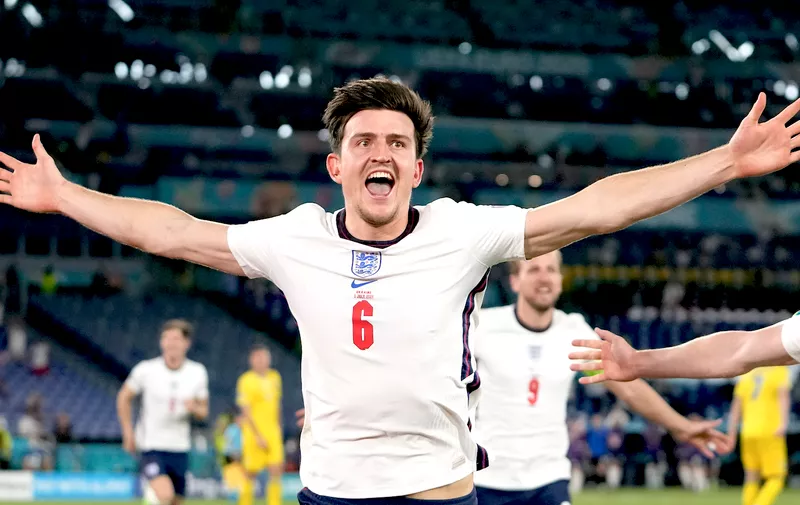 England's Harry Maguire celebrates after scoring his side's second goal during the Euro 2020 soccer championship quarterfinal match between Ukraine and England at the Olympic stadium in Rome at the Olympic stadium in Rome, Italy, Saturday, July 3, 2021. (AP Photo/Alessandra Tarantino, Pool)