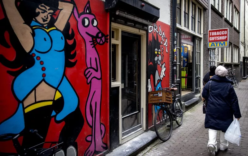 AMSTERDAM - A graffiti painting on the Red Light District. In the fight against nuisance caused by drug use in public spaces, it is prohibited from mid-May to smoke weed on the street in the old city center of Amsterdam. ANP KOEN VAN WEEL netherlands out - belgium out (Photo by Koen van Weel / ANP MAG / ANP via AFP)