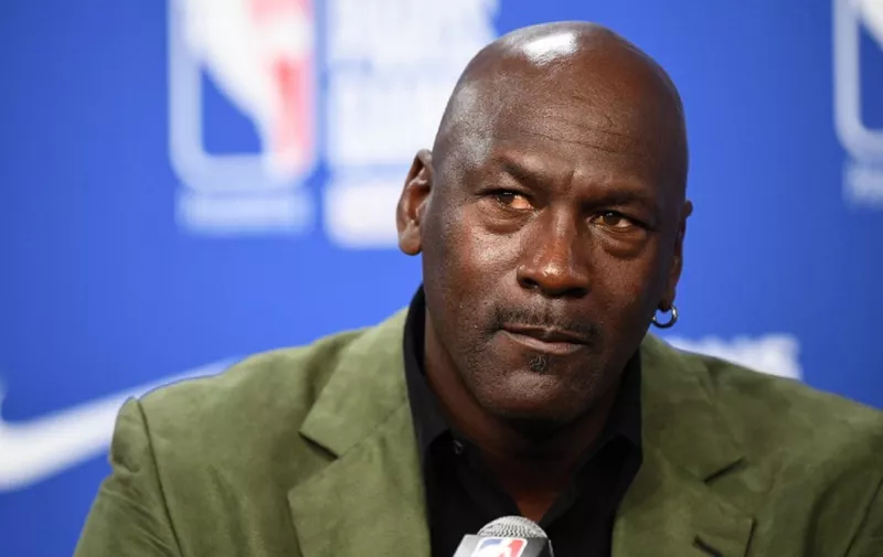 (FILES) In this file photo taken on January 24, 2020 former NBA star and owner of Charlotte Hornets team Michael Jordan looks on as he addresses a press conference ahead of the NBA basketball match between Milwaukee Bucks and Charlotte Hornets at The AccorHotels Arena in Paris. - Michael Jordan said June 5, 2020, he is making a record $100 million donation to groups fighting for racial equality and social justice amid a wave of protests across the United States. (Photo by FRANCK FIFE / AFP)