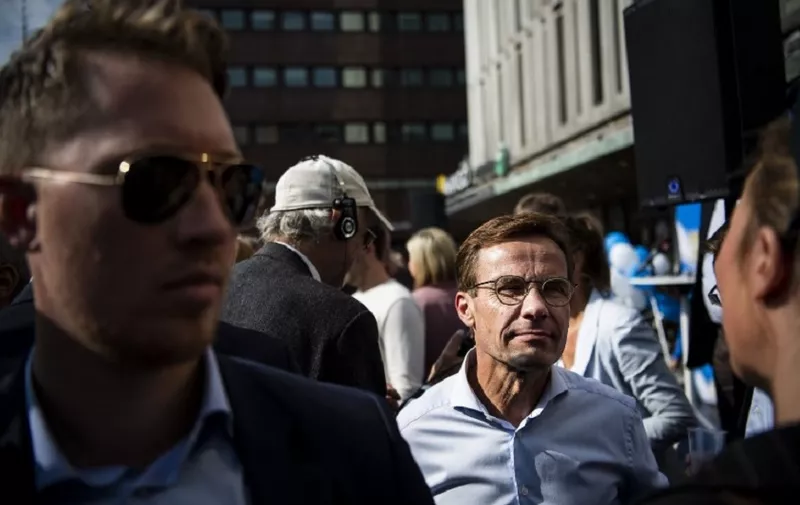 Ulf Kristersson (C), leader of the Moderate Party in Sweden, speaks with journalists on the sidelines of a rally of the Alliansen and all its leaders in Stockholm on September 8, 2018, as part of the election campaign before the September 9 general election.
The alliance consists of the Moderate Party, the Centre Party, Liberals and Christian Democrats. Sweden holds legislative elections on Sunday, September 9, 2018, with polls predicting a parliamentary deadlock as neither Prime Minister Stefan Lofven's left-wing bloc nor the opposition centre-right are seen winning a majority, while the far-right makes gains. / AFP PHOTO / Jonathan NACKSTRAND