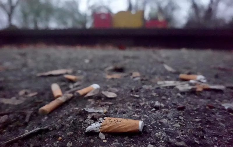13 January 2022, Hamburg: Cigarette butts lying on a playground. The CDU in Hamburg is calling for tougher action against butts in playgrounds. Photo: Marcus Brandt/dpa (Photo by MARCUS BRANDT / DPA / dpa Picture-Alliance via AFP)