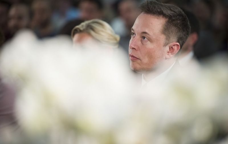 US automotive and energy storage company Tesla's CEO Elon Musk, the South African-born Canadian-American business magnate, engineer, inventor and investor takes part in a seminar on the business of the future hosted by German Economy Minister Sigmar Gabriel at the economy ministry in Berlin on September 24, 2015.   AFP PHOTO / ODD ANDERSEN / AFP PHOTO / ODD ANDERSEN