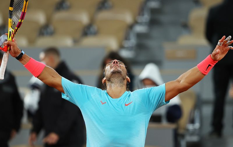 PARIS, FRANCE - OCTOBER 06: Rafael Nadal of Spain celebrates after winning match point during his Men's Singles quarterfinals match against Jannik Sinner of Italy on day ten of the 2020 French Open at Roland Garros on October 06, 2020 in Paris, France. (Photo by Julian Finney/Getty Images)