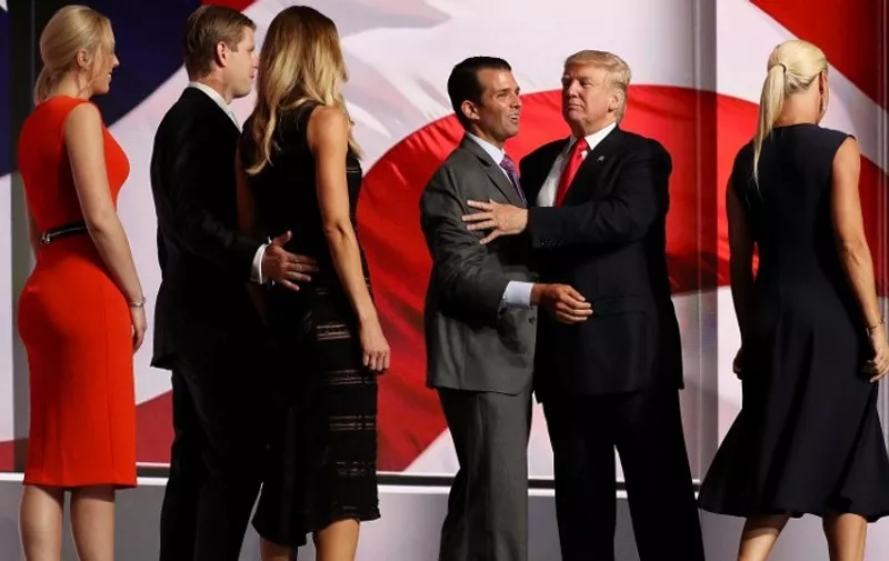 CLEVELAND, OH - JULY 21: Republican presidential candidate Donald Trump and his son Donald Trump Jr. embrace as Eric Trump, Lara Yunaska, Tiffany Trump and Vanessa Trump look on on the fourth day of the Republican National Convention on July 21, 2016 at the Quicken Loans Arena in Cleveland, Ohio. Republican presidential candidate Donald Trump received the number of votes needed to secure the party's nomination. An estimated 50,000 people are expected in Cleveland, including hundreds of protesters and members of the media. The four-day Republican National Convention kicked off on July 18.   Joe Raedle/Getty Images/AFP