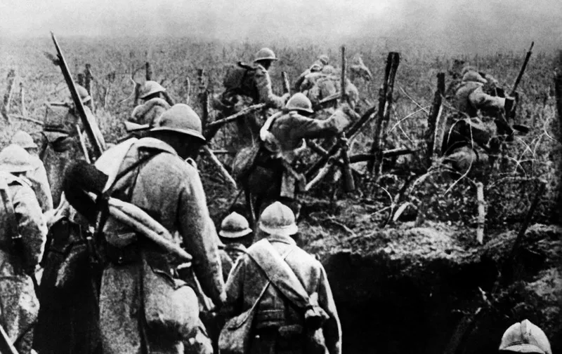 Picture taken in 1916 of French soldiers moving into attack from their trench during the Verdun battle, eastern France, during the first World War. The battle won by the French in November 1916 cost the life of 163.000 French soldiers and 143.000 German soldiers. (Photo by AFP)