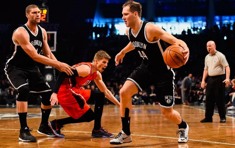 NEW YORK, NY - APRIL 25: Bojan Bogdanovic #44 of the Brooklyn Nets attempts to drive past teammate Brook Lopez #11 and Kyle Korver #26 of the Atlanta Hawks during the first round of the 2015 NBA Playoffs at Barclays Center on April 25, 2015 in the Brooklyn borough of New York City. NOTE TO USER: User expressly acknowledges and agrees that, by downloading and/or using this photograph, user is consenting to the terms and conditions of the Getty Images License Agreement.   Alex Goodlett/Getty Images/AFP