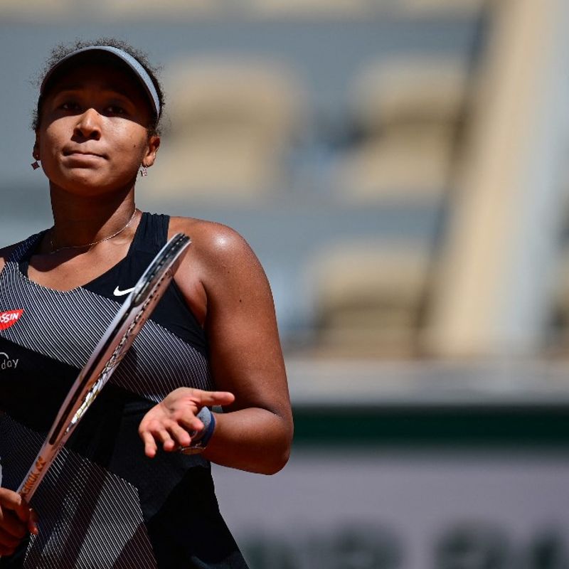 Japan's Naomi Osaka celebrates after winning against Romania's Patricia Maria Tig during their women's singles first round tennis match on Day 1 of The Roland Garros 2021 French Open tennis tournament in Paris on May 30, 2021. (Photo by MARTIN BUREAU / AFP)