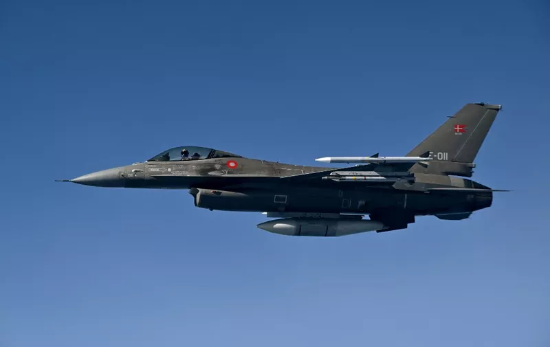 A Royal Danish Air Force F-16 jetfighter takes part in the NATO exercise as part of the NATO Air Policing mission, in Alliance members sovereign airspace on July 4, 2023. (Photo by John THYS / AFP)