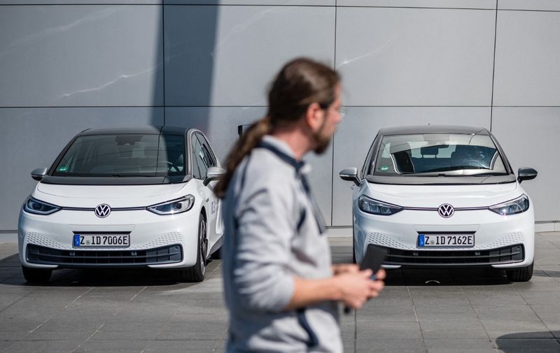 Volkswagen ID.3 electric cars are seen during the delivery of the first vehicles to German customers in Dresden, eastern Germany on September 13, 2020. - Volkswagen started delivering the ID.3 electric car to its first customers today. According to its own information, Volkswagen has already sold around 25,000 cars across Europe. (Photo by Jens SCHLUTER / AFP)