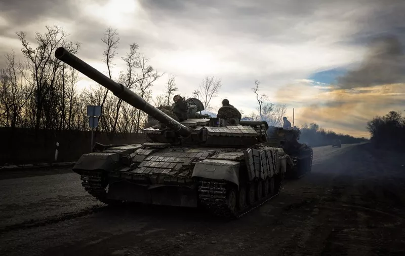 A Ukrainian tank rolls on a road near Bakhmut, in the Donetsk region, on November 30, 2022, amid the Russian invasion of Ukraine. (Photo by ANATOLII STEPANOV / AFP)