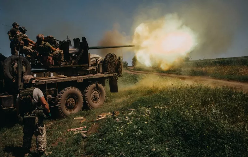BAKHMUT, UKRAINE - JUNE 19: Ukrainian soldiers from the 60th Battalion of Territorial Defense, are shooting rounds into Russian positions with an S60 anti-aircraft canon placed on a truck, outside Bakhmut, Ukraine on June 19, 2023. Wojciech Grzedzinski / Anadolu Agency (Photo by WOJCIECH GRZEDZINSKI / ANADOLU AGENCY / Anadolu Agency via AFP)