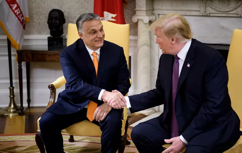 Hungary's Prime Minister Viktor Orban (L) and US President Donald Trump shake hands before a meeting in the Oval Office of the White House May 13, 2019, in Washington, DC. (Photo by Brendan Smialowski / AFP)