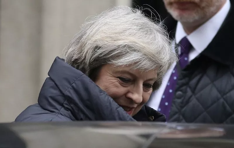 Britain's Prime Minister Theresa May leaves 10 Downing Street in central London on January 25, 2017 to attend the weekly Prime Minister's Questions in the House of Commons.
May was set to answer MP's question at Parliament a day after The Supreme Court's landmark ruling that the government must win parliament's approval before starting talks for Britain to leave the European Union. May will this week be the first foreign leader to meet with Donald Trump since his inauguration, aiming to discuss a key post-Brexit trade deal with the US.  / AFP PHOTO / Daniel LEAL-OLIVAS