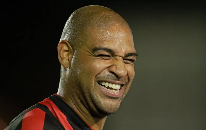 Footballer Adriano, of Brazil's Atletico Paranaense, smiles during the Libertadores Cup football match against Bolivia's The Strongest, at the Vila Capanema stadium in Curitiba on February 13, 2014.  AFP PHOTO/HEULER ANDREY / AFP / Heuler Andrey