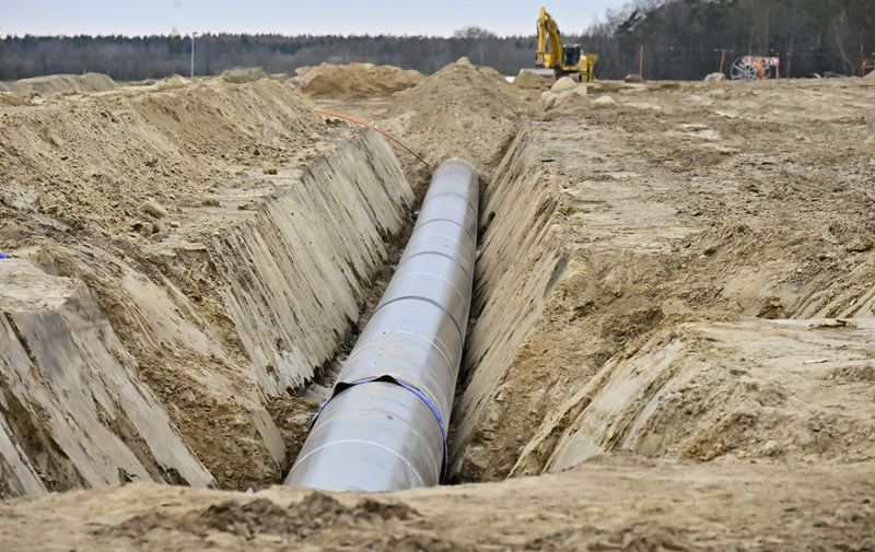 The construction site of the new European Gas Pipeline Link (EUGAL) pipeline is pictured on March 26, 2019 near Lubmin, northeastern Germany, close to the planned landing point for the Nord Stream 2 gas pipeline carrying gas from Russia to Europe. - The Nord Stream 2 and EUGAL pipelines join in Lubmin, from where the natural gas will be distributed within Europe. The Nord Stream 2 pipeline will double the capacity to ship gas from Russia to Germany via the waters of Finland, Sweden and Denmark. The pipeline has faced opposition from many countries in eastern and central Europe, the United States and particularly Ukraine because it risks increasing Europe's dependence on Russian natural gas. (Photo by Tobias SCHWARZ / AFP)