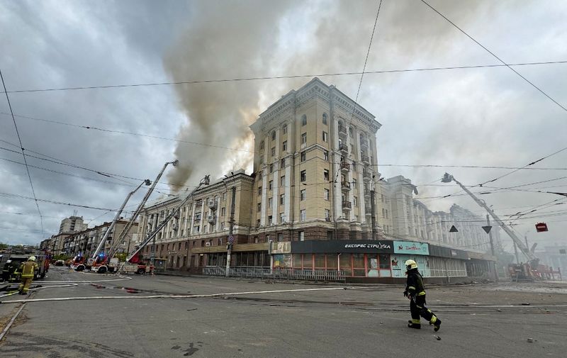 Ukrainian rescuers try to extinguish a fire in a residential building following a missile attack in Dnipro on April 19, 2024, amid the Russian invasion of Ukraine. Russian strikes overnight killed eight people, including two children, and injured 18 in Ukraine's central Dnipropetrovsk region, the interior ministry said on April 19, 2024, updating the toll. (Photo by STRINGER / AFP)