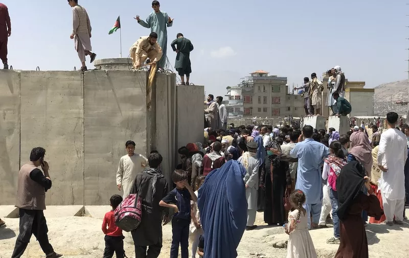 People struggle to cross the boundary wall of Hamid Karzai International Airport to flee the country after rumors that foreign countries are evacuating people even without visas, after the Taliban over run of Kabul, Afghanistan, 16 August 2021.
Chaos at Kabul airport as afghans try to leave capital, Afghanistan - 16 Aug 2021,Image: 627337151, License: Rights-managed, Restrictions: , Model Release: no, Credit line: Profimedia