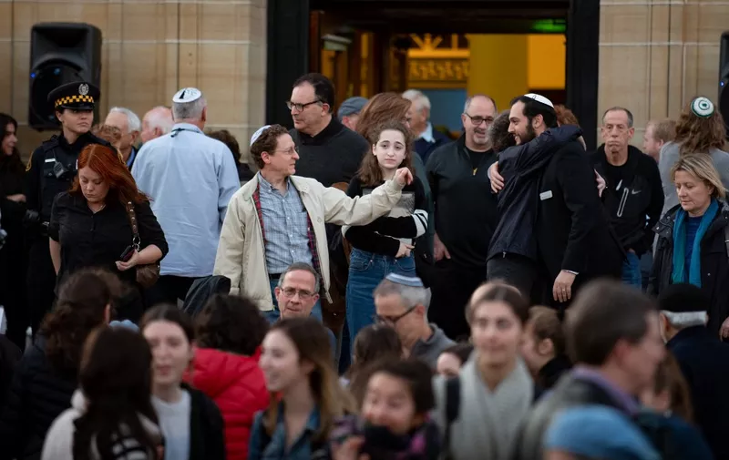 PITTSBURGH, PA - OCTOBER 27: Attendees greet each other after public memorial service honoring the lives lost in the attack on the Tree of Life Synagogue on October 27, 2018 at the Soldiers and Sailors Memorial on October 27, 2019 in Pittsburgh, Pennsylvania. One year ago, Robert Bowers killed 11 people and wounded severa others during an attack of the Tree of Life synagogue.   Jeff Swensen/Getty Images/AFP (Photo by JEFF SWENSEN / GETTY IMAGES NORTH AMERICA / Getty Images via AFP)