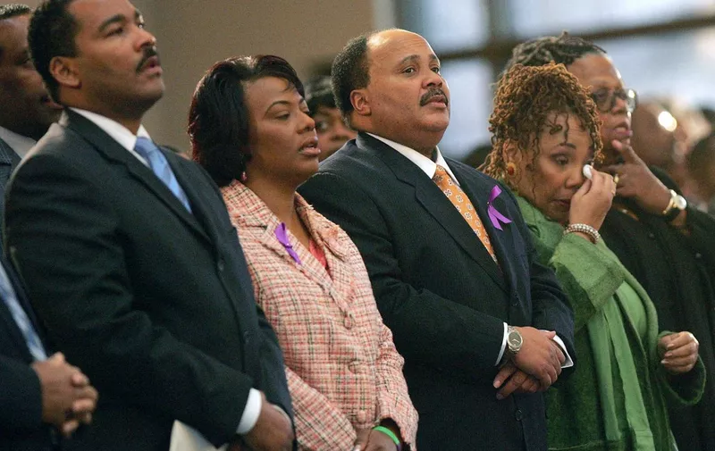 The children of Coretta Scott King, L-R: Dexter Scott King, Rev. Bernice King, Martin Luther King III and Yolanda King react during a musical tribute to their mother at the new Ebenezer Church 06 February 2006 in Atlanta, Georgia. King's casket will lie in Ebenezer Baptist Church, where her husband the Rev. Martin Luther King Jr preached in the 1960s and the civil rights matriarch remained a member until her death. King died 31 January in Mexico at an alternative medicine clinic, where doctors said she was battling advanced ovarian cancer. (Photo by POOL / AFP)