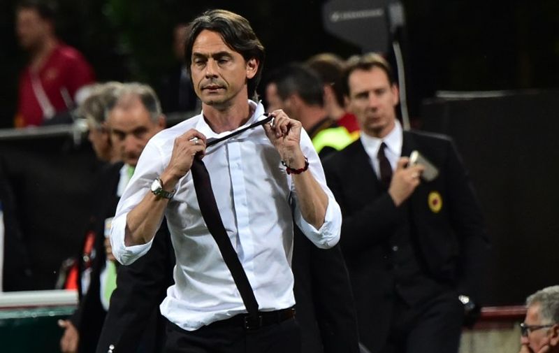 AC Milan's coach Filippo Inzaghi leaves the pitch after being sent off by the referee during the Serie A football match between AC Milan and AS Roma at San Siro Stadium in Milan on May 9, 2015.  AFP PHOTO / GIUSEPPE CACACE / AFP / GIUSEPPE CACACE