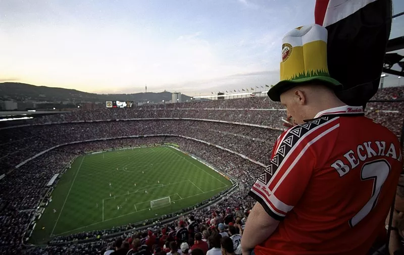 26 May 1999: A Manchester United fan watches play in the European Champions League Final against Bayern Munich in the Nou Camp stadium in Barcelona, Spain. Manchester United won 2 &#8211; 1 with both United goals scored during injury time, to secure the treble of League, FA Cup and European Cup. Mandatory Credit: Mark Thompson [&hellip;]