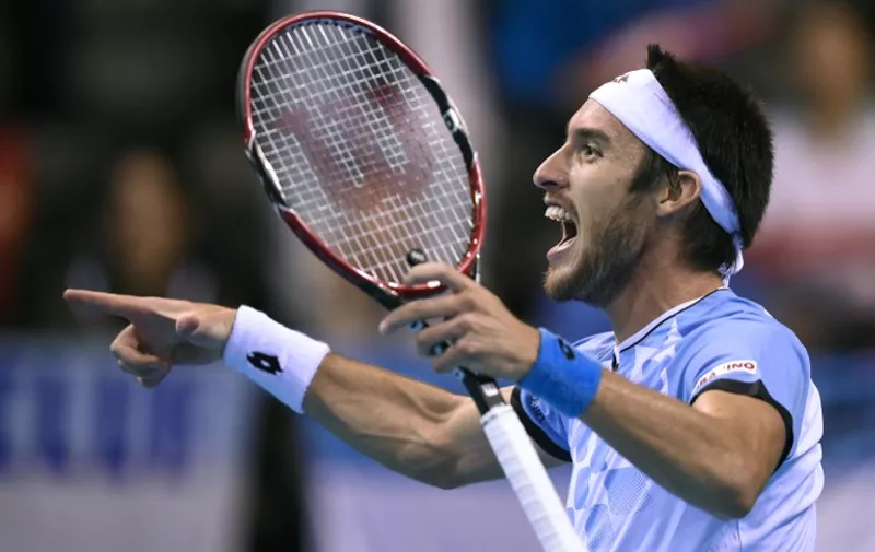 Argentinia's Leonardo Mayer reacts after winning the Davis cup semi-final against Belgium's Steve Darcis at the Forest National Arena on September 18, 2015. AFP PHOTO/JOHN THYS