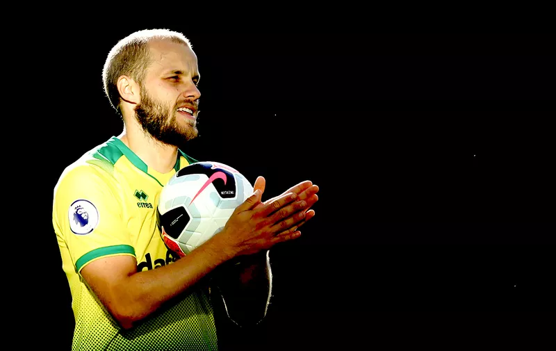NORWICH, ENGLAND - AUGUST 17: Teemu Pukki of Norwich City celebrates with the match ball after his hat trick during the Premier League match between Norwich City and Newcastle United at Carrow Road on August 17, 2019 in Norwich, United Kingdom. (Photo by Marc Atkins/Getty Images)