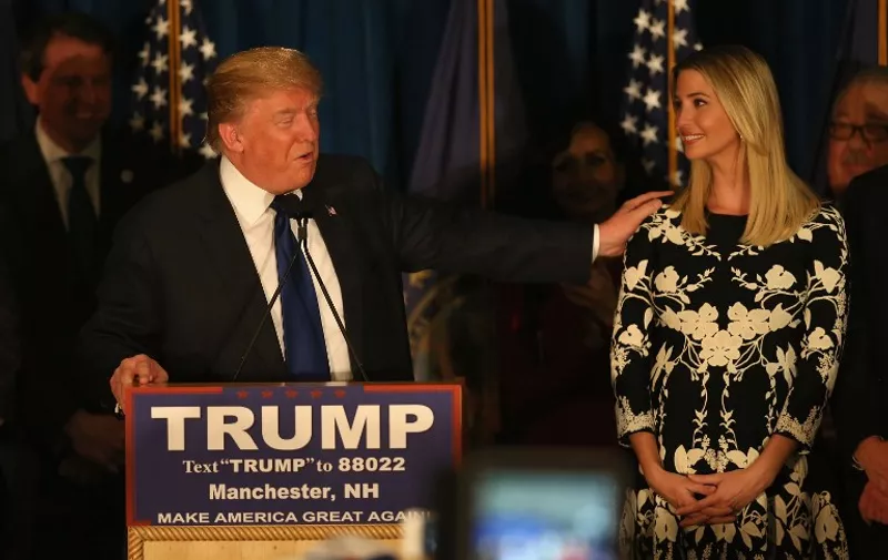 MANCHESTER, NH - FEBRUARY 09: Republican presidential candidate Donald Trump speaks as his daughter Ivanka Trump after Primary day at his election night watch party at the Executive Court Banquet facility on February 9, 2016 in Manchester, New Hampshire. Trump was projected the Republican winner shortly after the polls closed.   Joe Raedle/Getty Images/AFP