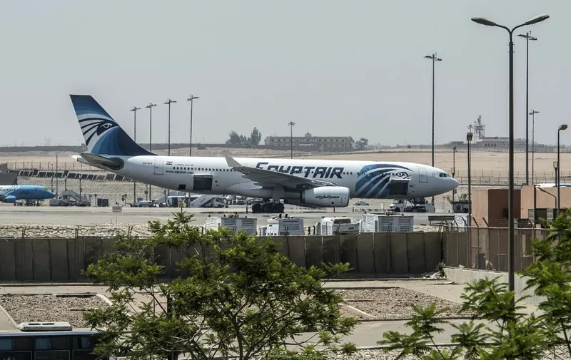 An EgyptAir plane is seen on the tarmac at Cairo international airport on May 19, 2016 after an EgyptAir flight from Paris to Cairo crashed into the Mediterranean on with 66 people on board, prompting an investigation into whether it was mechanical failure or a bomb. - Egypt's aviation minister said he could not rule out that an attack or a technical failure brought down the plane. (Photo by KHALED DESOUKI / AFP)