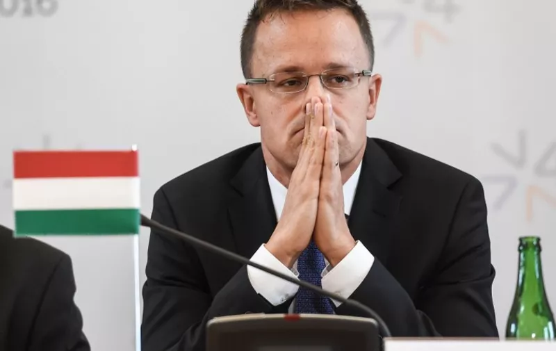 Hungary's foreign minister Peter Szijjarto attends a press conference as the Visegrad Group foreign ministers meet their counterparts from Germany and Luxembourg to talk about current migration crisis on September 11, 2015 in Prague. AFP PHOTO / MICHAL CIZEK