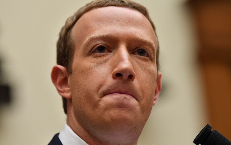 (FILES) In this file photo taken on October 23, 2019 Facebook Chairman and CEO Mark Zuckerberg testifies before the House Financial Services Committee on "An Examination of Facebook and Its Impact on the Financial Services and Housing Sectors" in the Rayburn House Office Building in Washington, DC. - Shares of Facebook parent Meta plunged 24 percent in opening trading February 3, 2022, weighing on the Nasdaq and threatening the stock market's four-day winning streak. (Photo by Nicholas Kamm / AFP)