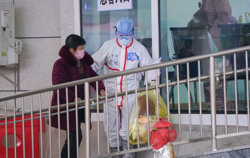 A medical worker (R) guides a patient at Jiangxia temporary hospital in Wuhan, capital city of central China's Hubei Province
Coronavirus outbreak, China - 14 Feb 2020
Jiangxia temporary hospital, a 400-bed hospital converted from an outdoor sports center, started to receive COVID-19 patients with mild symptoms on Friday. The hospital is the first temporary hospital that mainly adopt Traditional Chinese medicines (TCM) to treat the patients., Image: 498702410, License: Rights-managed, Restrictions: , Model Release: no, Credit line: CHINE NOUVELLE/SIPA / Shutterstock Editorial / Profimedia