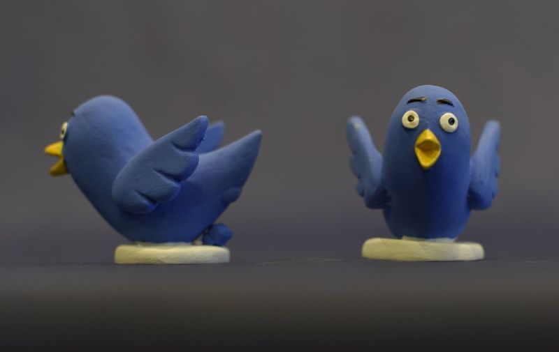 A picture taken on November 19, 2015 shows ceramic figurines representing Twitter logo, called "Caganers" during their presentation in Torroella de Montgri, near Gerona. Statuettes of well-known people defecating are a strong Christmas tradition in Catalonia, dating back to the 18th century as Catalans hide caganers in Christmas Nativity scenes and invite friends to find them. The figures symbolize fertilization, hope and prosperity for the coming year. AFP PHOTO / LLUIS GENE / AFP PHOTO / LLUIS GENE