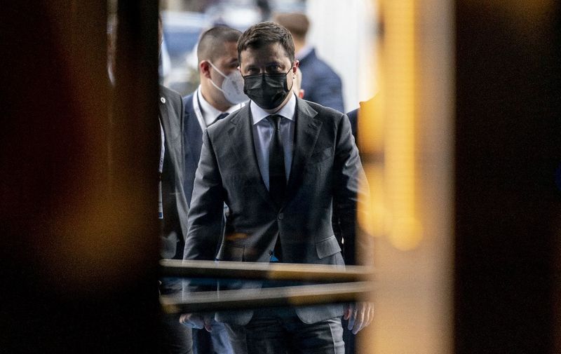 Ukrainian President Volodymyr Zelensky walks into the Bayerischer Hof Hotel after meeting with the US Vice President at the Munich Security Conference (MSC) in Munich, southern Germany, on February 19, 2022. - During the 58th Munich Security Conference running from February 18-20, 2022, international diplomats and experts meet to discuss topics such as global order, human and transnational security, defense or sustainability. (Photo by Andrew Harnik / POOL / AFP)