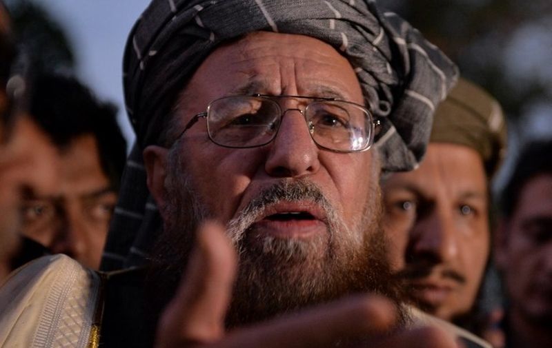Pakistani member of the negotiating committee from the Tehreek-e-Taliban Pakistan (TTP) Maulana Sami ul Haq speaks to media after meeting with the Pakistan government negotiation committee in Islamabad on April 23, 2014. Pakistan government meet again on April 23 for fresh peace talks with Taliban negotiators despite the militants' refusal to extend a ceasefire called to help peace efforts. Talks to end the Tehreek-e-Taliban Pakistan's (TTP) bloody seven-year insurgency have been under way since February 2014, with little clear progress made so far. AFP PHOTO/Aamir QURESHI (Photo by AAMIR QURESHI / AFP)