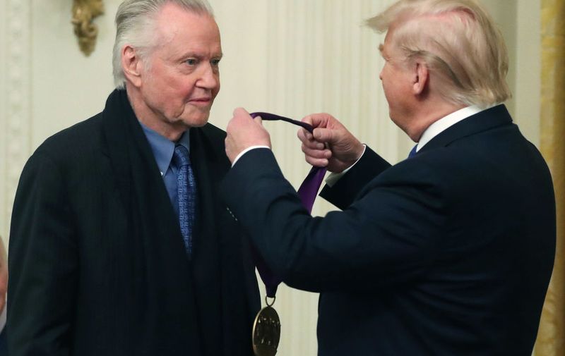 WASHINGTON, DC - NOVEMBER 21: U.S. President Donald Trump (R) presents actor Jon Voight with the National Medal of Arts during a ceremony in the East Room of the Whit House on November 21, 2019 in Washington, DC. (Photo by Mark Wilson/Getty Images)