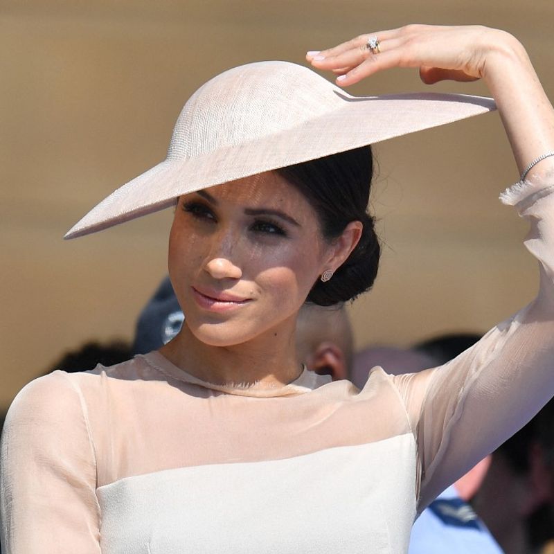 Britain's Meghan, Duchess of Sussex, attends the Prince of Wales's 70th Birthday Garden Party at Buckingham Palace in London on May 22, 2018. - The Prince of Wales and The Duchess of Cornwall hosted a Garden Party to celebrate the work of The Prince's Charities in the year of Prince Charles's 70th Birthday. (Photo by Dominic Lipinski / POOL / AFP)