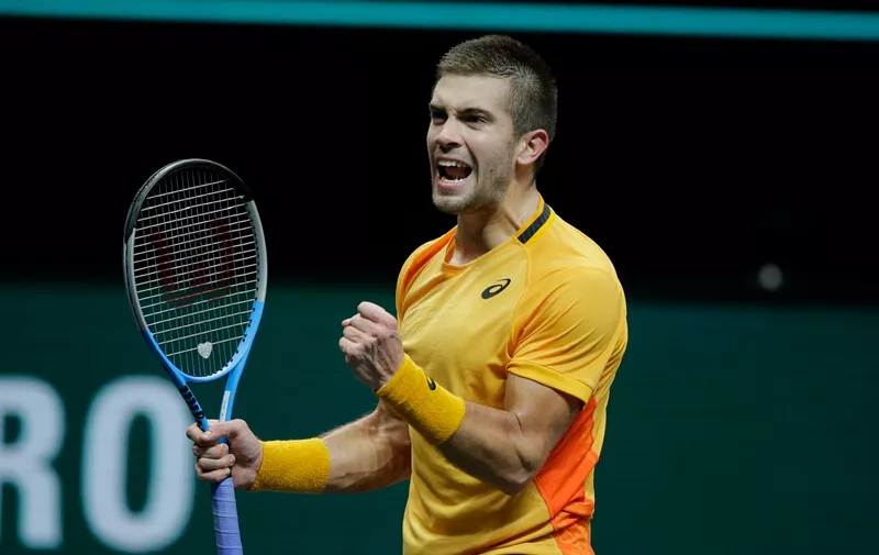 Croatia's Borna Coric celebrates winning in two sets 7-6, 7-6, against Japan's Kei Nishikori in their quarterfinal men's singles match of the ABN AMRO world tennis tournament at Ahoy Arena in Rotterdam, Netherlands, Friday, March 5, 2021. (AP Photo/Peter Dejong)