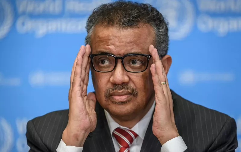 EDITORS NOTE: Graphic content / World Health Organization (WHO) Director-General Tedros Adhanom Ghebreyesus attends a daily press briefing on COVID-19 virus at the WHO headquaters on March 11, 2020 in Geneva. - WHO Director-General Tedros Adhanom Ghebreyesus announced on March 11, 2020 that the new coronavirus outbreak can now be characterised as a pandemic. (Photo by Fabrice COFFRINI / AFP)