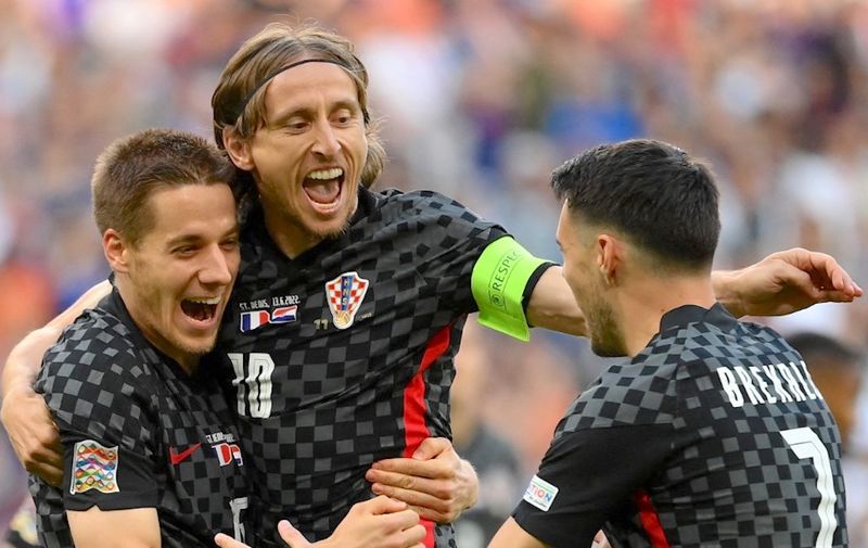 Croatia's midfielder Luka Modric (C) celebrates his team's first goal with teammates during the UEFA Nations League - League A Group 1 football match between France and Croatia at the Stade de France in Saint-Denis, on the outskirts of Paris on June 13, 2022. (Photo by Franck FIFE / AFP)