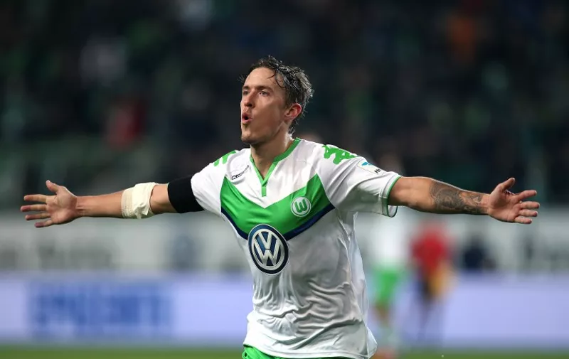 Wolfsburg's striker Max Kruse celebrates after scoring the 6-0 during the German first division Bundesliga football match VfL Wolfsburg vs Werder Bremen in Wolfsburg, northern Germany, on November 21, 2015. Wolfsburg won the match 6-0.   AFP PHOTO / RONNY HARTMANN

RESTRICTIONS: DURING MATCH TIME: DFL RULES TO LIMIT THE ONLINE USAGE TO 15 PICTURES PER MATCH AND FORBID IMAGE SEQUENCES TO SIMULATE VIDEO. 
==RESTRICTED TO EDITORIAL USE ==
FOR FURTHER QUERIES PLEASE CONTACT THE DFL DIRECTLY AT + 49 69 650050. / AFP / RONNY HARTMANN