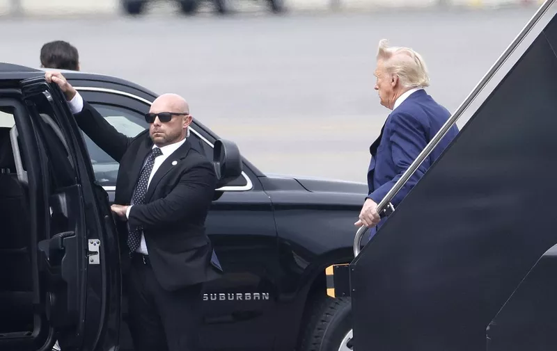 ARLINGTON, VIRGINIA - AUGUST 3: Former U.S. President Donald Trump arrives at Ronald Reagan Washington National Airport on August 3, 2023 in Arlington, Virginia. Trump is scheduled to be arraigned on four felony counts in federal court today for his alleged efforts to overturn the results of the 2020 presidential election.   Tasos Katopodis/Getty Images/AFP (Photo by TASOS KATOPODIS / GETTY IMAGES NORTH AMERICA / Getty Images via AFP)