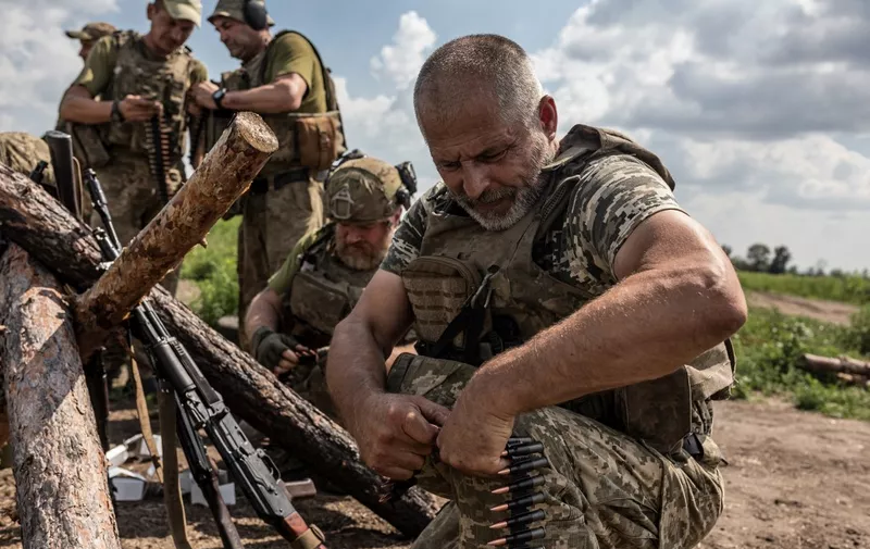 DONETSK OBLAST, UKRAINE - AUGUST 18: Ukrainian soldiers prepare bullets for a machine gun during training as the Russia-Ukraine war continues in Donetsk Oblast, Ukraine on August 18, 2023. Diego Herrera Carcedo / Anadolu Agency (Photo by Diego Herrera Carcedo / ANADOLU AGENCY / Anadolu Agency via AFP)