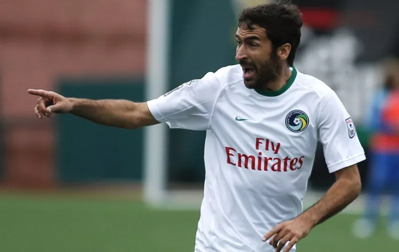 Cosmos's player Raul reacts during a soccer match against the Fort Lauderdale Strikers in the NASL Championship semifinals on Coney Island, November 7, 2015 in New York.  The Cosmos defeated the Strikers 2-1.  AFP PHOTO / Kena Betancur / AFP / KENA BETANCUR