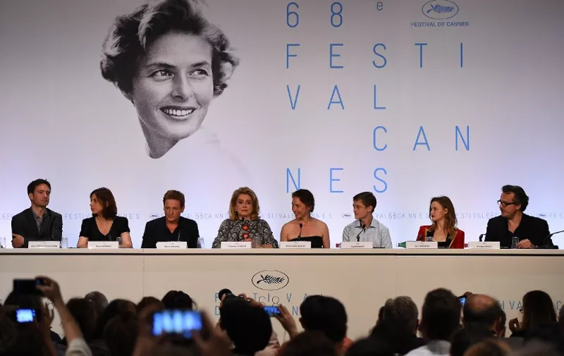 (From L) French producer Denis Pineau-Valencienne, screenwriter Marcia Romano, actor Benoit Magimel, actress Catherine Deneuve, director Emmanuelle Bercot, actor Rod Paradot, actress Sara Forestier and producer Francois Kraus attend a press conference for their film "Standing Tall" (Tete Haute) ahead of the opening of the 68th Cannes Film Festival in Cannes, southeastern France, on May 13, 2015. AFP PHOTO / ANNE-CHRISTINE POUJOULAT