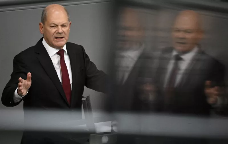 German Chancellor Olaf Scholz addresses delegates during a debate on the federal budget 2023 at the Bundestag (lower house of parliament) on September 7, 2022 in Berlin. (Photo by Tobias SCHWARZ / AFP)