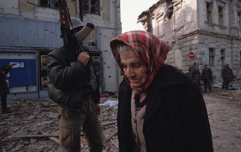 Ethnic Cleansing - A Croatian woman walks past a Serbian fighter as she leaves her destroyed city of Vukovar, Croatia, Nov. 24, 1991. Vukovar was under siege for three months by Serbian forces and completely destroyed., Image: 116177610, License: Rights-managed, Restrictions: Content available for editorial use, pre-approval required for all other uses.
This content not available to be downloaded through Quick Pic
Not available for license and invoicing to customers located in the Czech Republic.
Not available for license and invoicing to customers located in the Netherlands.
Not available for license and invoicing to customers located in India.
Not available for license and invoicing to customers located in Italy.
Not available for license and invoicing to customers located in Finland., Model Release: no, Credit line: Profimedia, Corbis VII